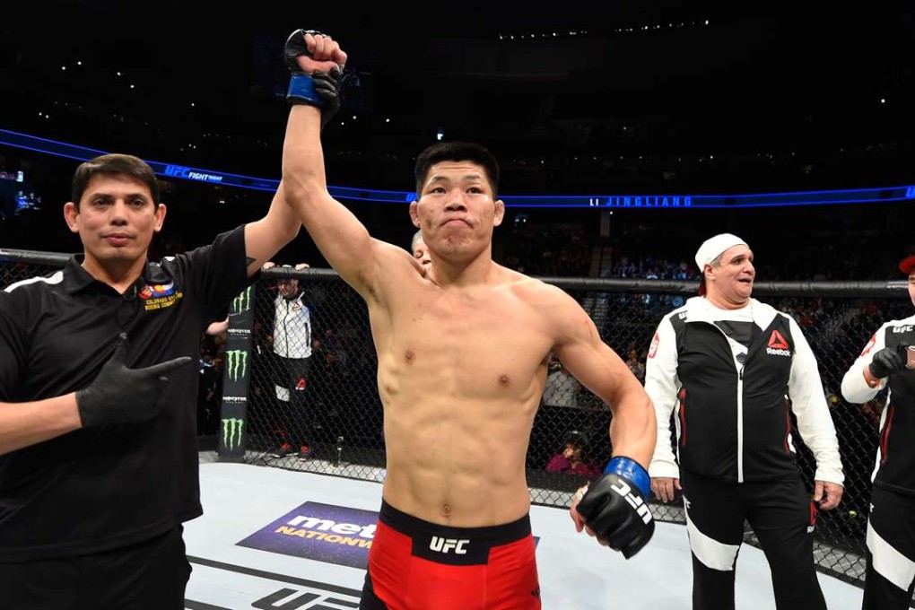 Li Jingliang celebrates his UFC win over Bobby Nash. Photo: Getty Images