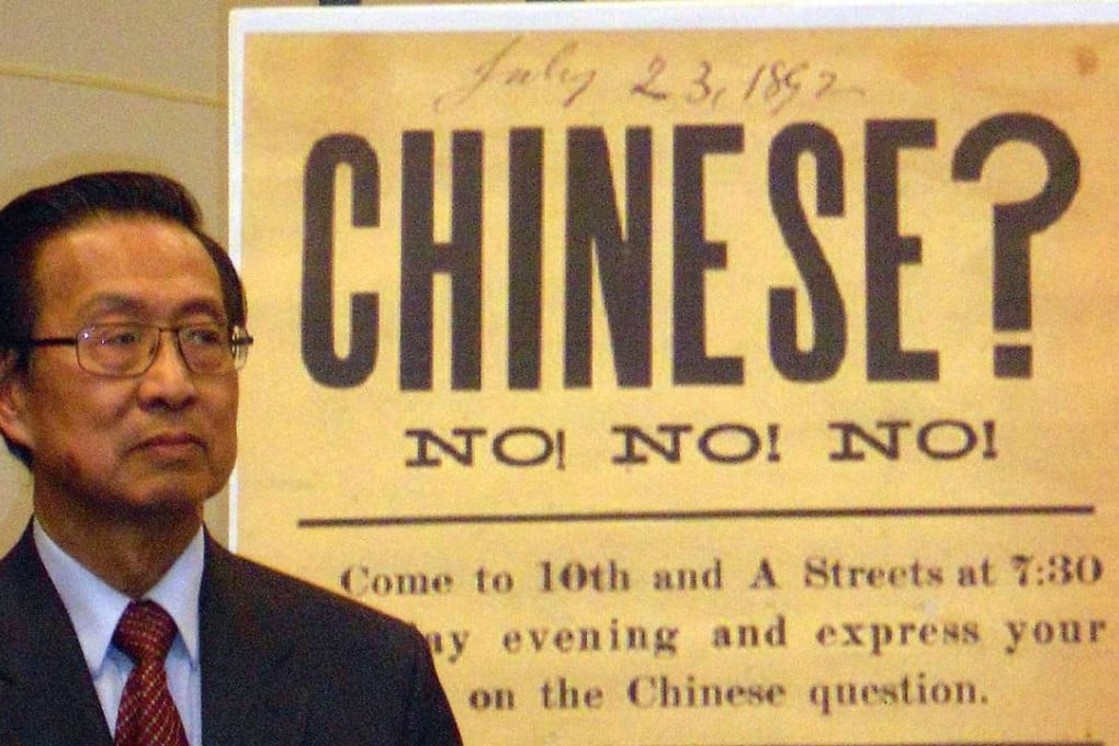 Michael Lin, chair of the 1882 Project, in front of a 19th century sign. The 1882 project was formed to push for an official statement of regret over the Chinese Exclusion Act. Congress passed a motion to “express regret” in 2012. Photo: AFP