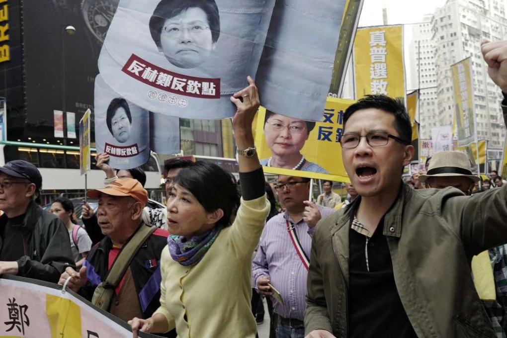 Protesters raise slogans during a rally against the handpicking of Carrie Lam as the preferred chief executive, on February 5 in Hong Kong. Photo: AP
