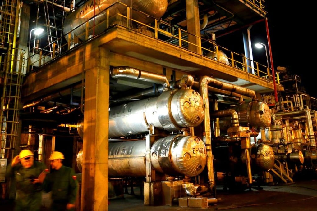 Employees walk in Hungarian oil and gas group MOL's main Danube refinery in Hungary. Photo: Reuters