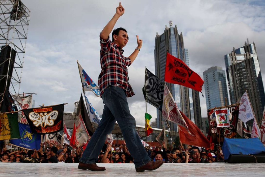 Jakarta governor Basuki Tjahaja Purnama, known as Ahok, waves to the crowd as he attends a music concert ahead of this month's elections in Jakarta. Photo: Reuters