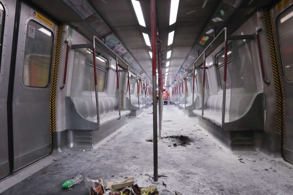 Burned objects are strewn across the charred floor of the train carriage where the firebomb attack occurred. Photo: Edward Wong