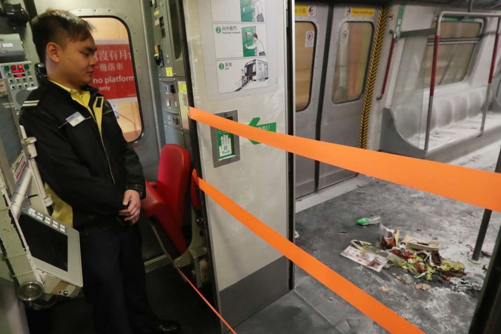 Burned objects are strewn across the charred floor of the train carriage where the firebomb attack occurred. Photo: Edward Wong