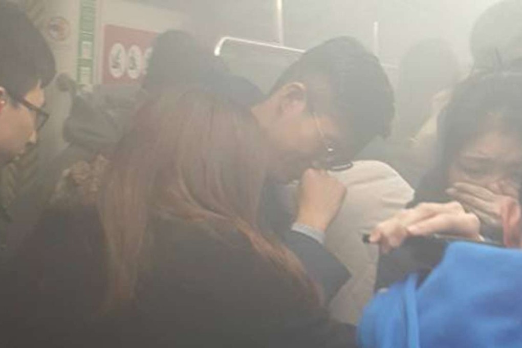 Commuters battled through choking smoke after a man lit a petrol bomb and threatened to kill passengers of the Tsuen Wan-bound train on Friday. Photo: Facebook