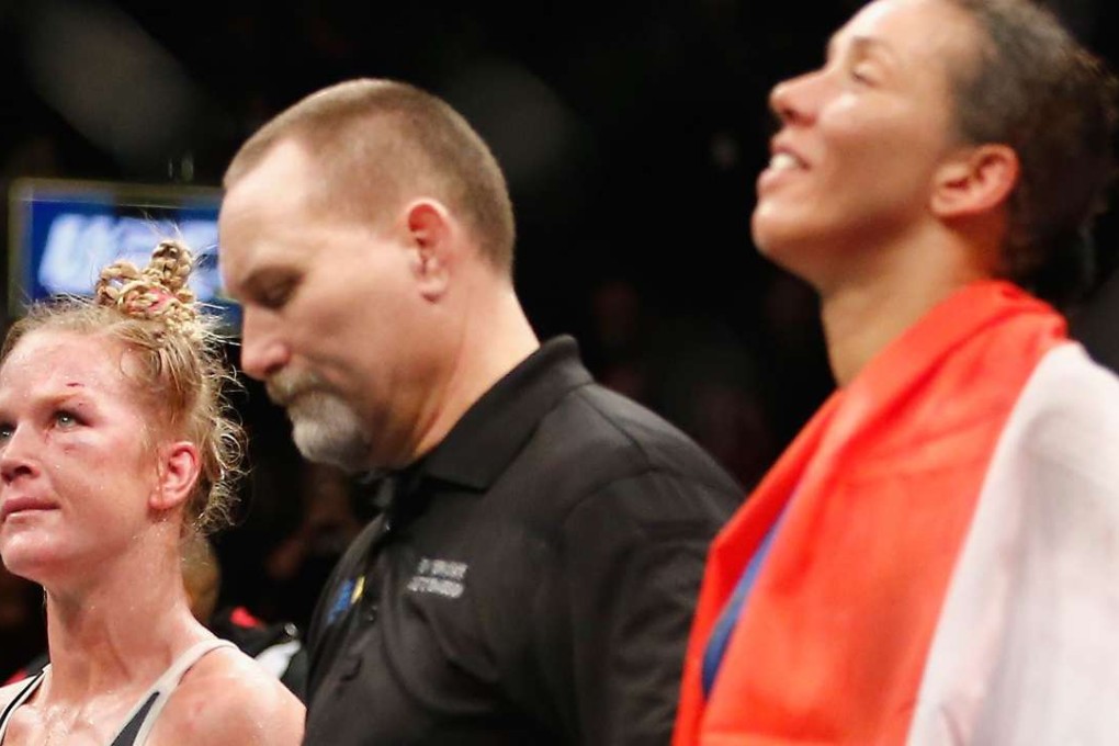 Holly Holm and Germaine de Randamie wait to hear the decision. Photo: AFP