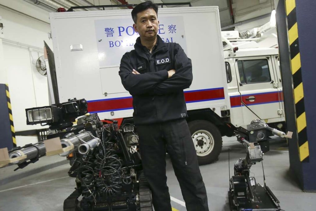 Senior bomb disposal officer Tony Chow poses with some robotic equipment. Photo: David Wong