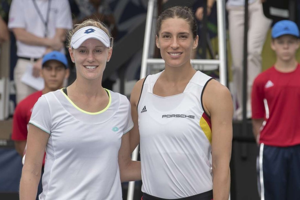 Andrea Petkovic (right) and Alison Riske at the net before their Fed Cup match Photo: USA Today