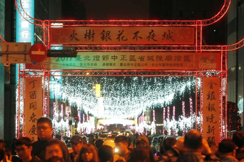 Visitors throng to the Lantern Festival in Taipei, Taiwan, to mark the end of Lunar New Year celebrations on February 6. Taiwanese officials and media reports are blaming a cold spell for the deaths of more than 150 people, most of them elderly and sick, over the past several days. Photo: AP