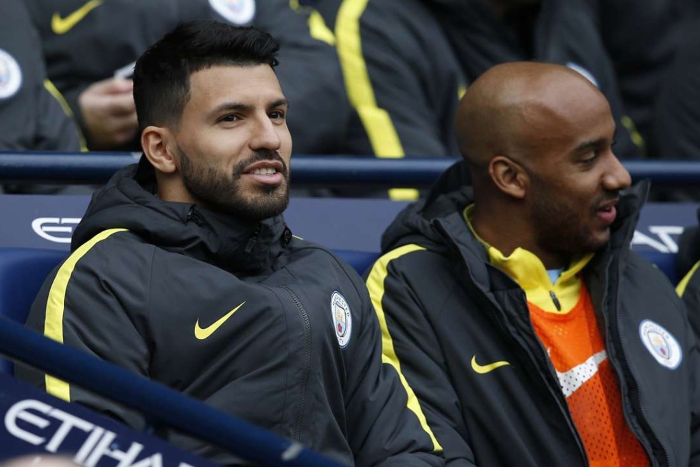 Manchester City's Sergio Aguero (left) on the bench against Swansea City. Photo: Reuters