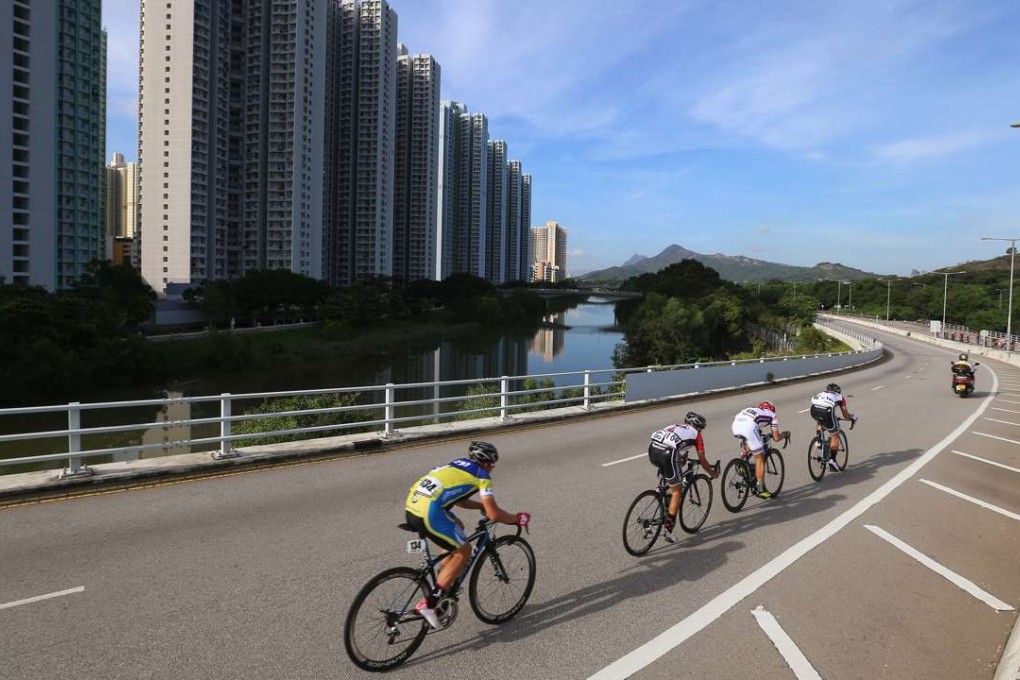 Cyclists ride down a road in Tin Shui Wai in a race in 2015. The city’s first Integrated Community Centre for Mental Wellness was set up in Tin Shu Wai. Photo: Edmond So