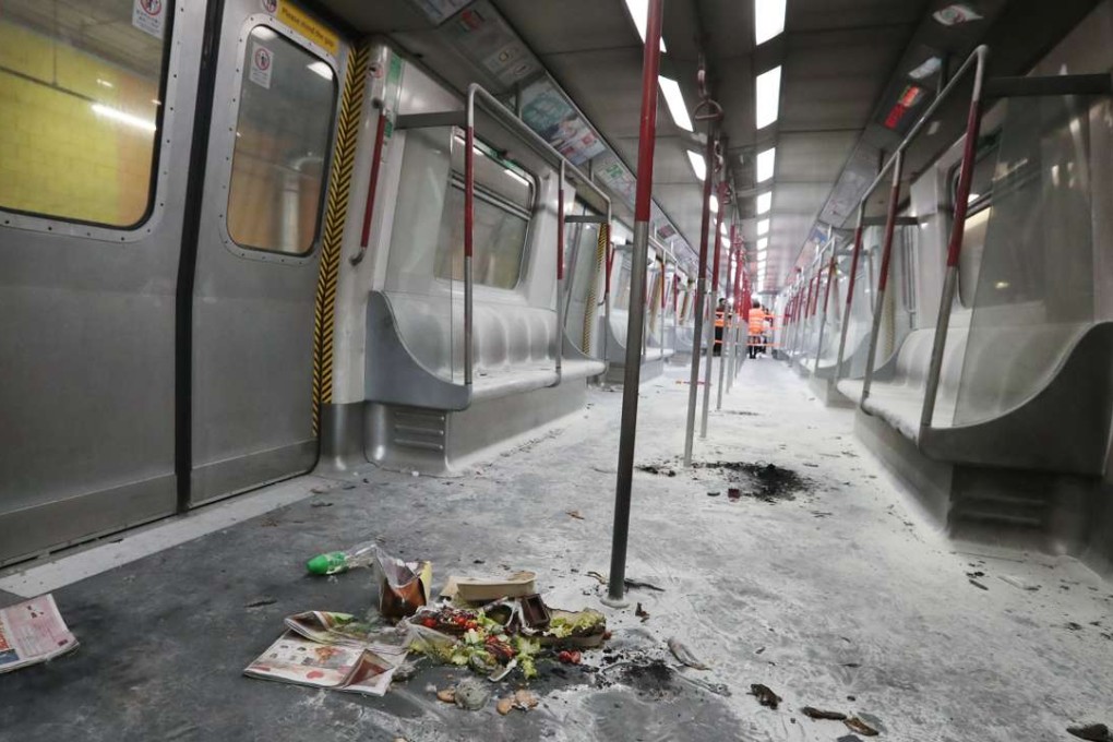 Burned objects are strewn across the charred floor of the train carriage where the firebomb attack occurred. Photo: Edward Wong