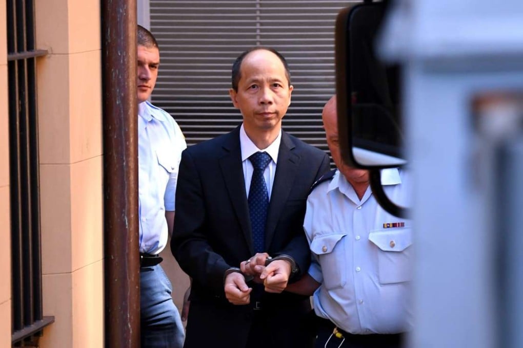 Robert Xie is escorted to a prison transport vehicle at the NSW Supreme Court in Sydney on Monday. Photo: EPA