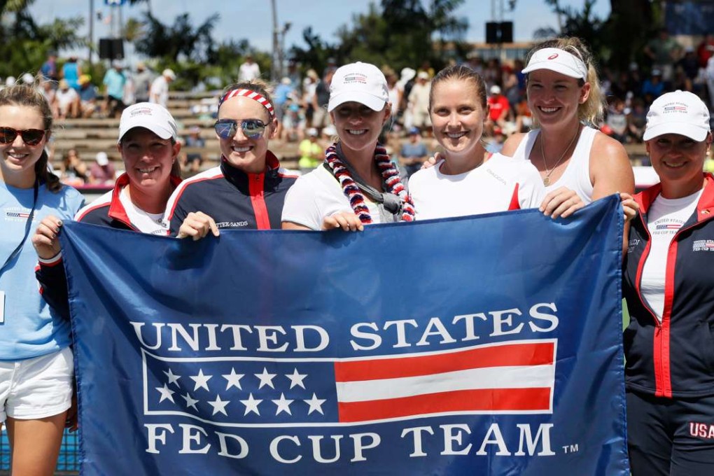Coco Vandeweghe (second right) of the USA celebrates with her teammates after defeating Andrea Petkovic of Germany. Photo: EPA