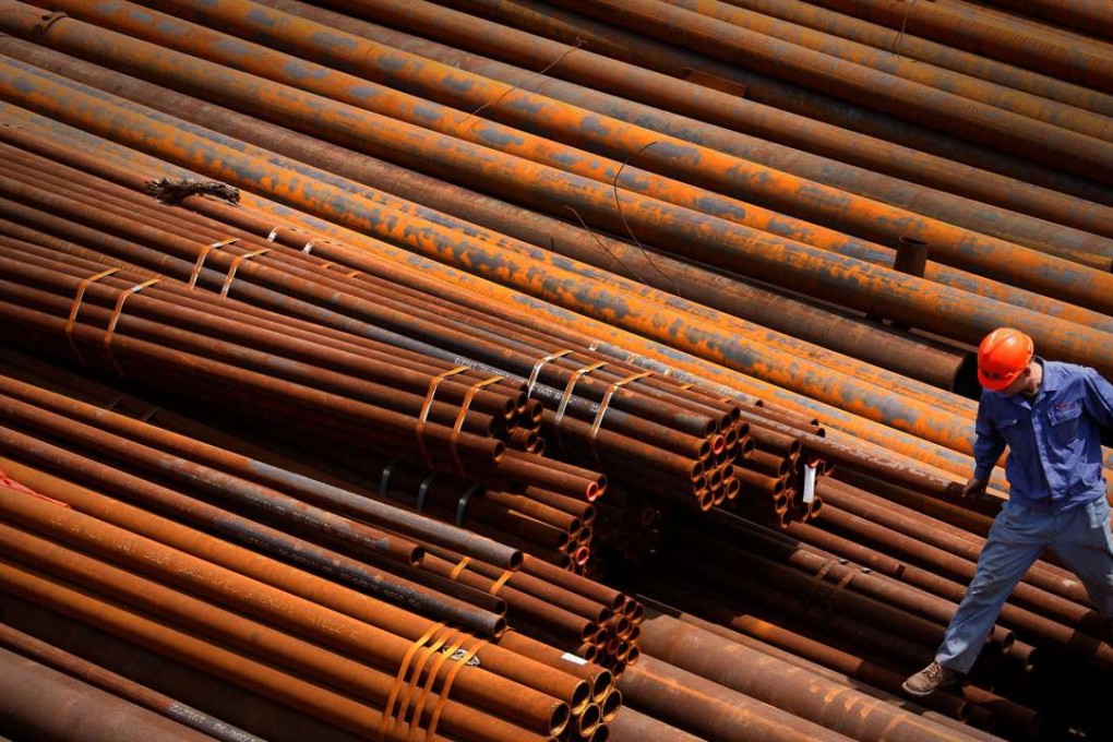 In this photo taken on May 10, 2010, a worker walk on the steel pipes at an iron and steel factory in Huaibei in central China's Anhui province. China's industrial growth slowed further in July as Beijing clamped down on a credit boom, while inflation spiked to its highest level this year amid summer flooding that wrecked crops. The government data Wednesday, Aug. 11, 2010, added to signs China's boom is cooling and fed expectations Beijing needs to reverse course after imposing lending curbs this year to prevent a bubble in stock and real estate prices. (AP Photo)**CHINA OUT**
