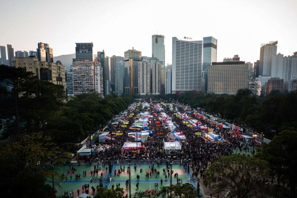 Crowds throng the New Year Flower Market in Victoria Park on January 27, the eve of the Lunar New Year holiday. Victoria Park is among prominent public open spaces around Hong Kong identified as having the potential for underground development. Photo: AFP