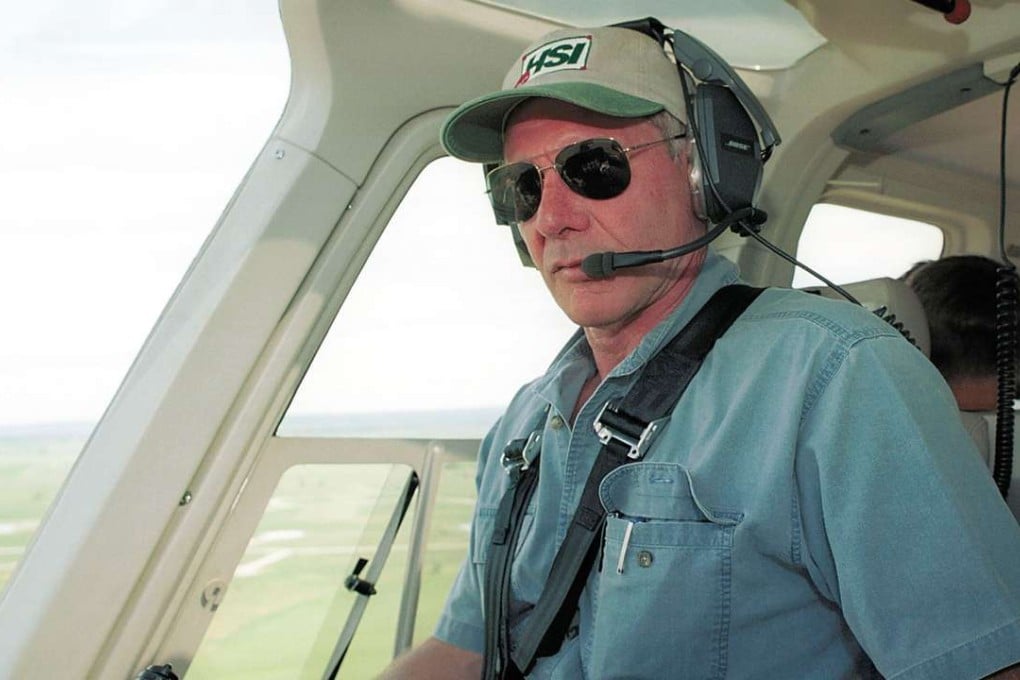 A file photo taken in 2001 shows actor Harrison Ford flying his helicopter near Jackson, Wyoming. Hollywood star Ford was involved in a near-miss at a California airport on Tuesday. Photo: AFP