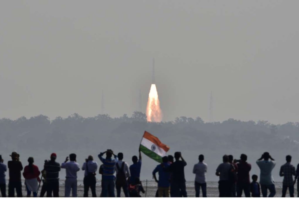 People watch as India’s Polar Satellite Launch Vehicle carrying 104 satellites in a single mission lifts off from the Satish Dhawan Space Centre in Sriharikota. Photo: Reuters
