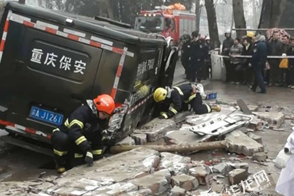 Firefighters work to release the elderly man from under the security van. He was not seriously injured. Photo: Handout