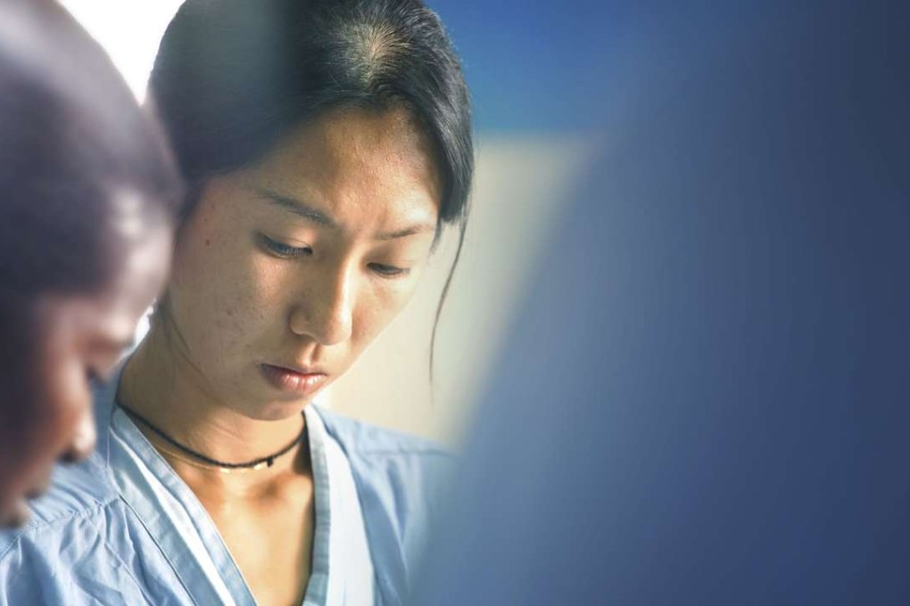 Dr Jessica Ng during ward rounds at the Emergency Surgical and Paediatric Centre in Sierra Leone. Photo: Chun Wai