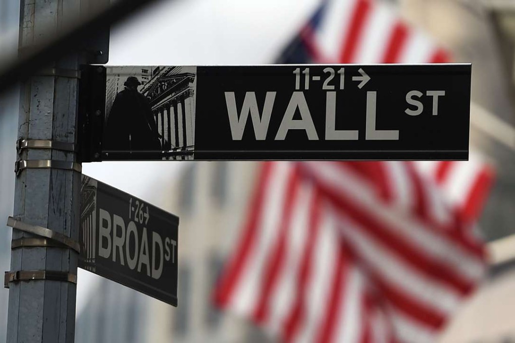 Hong Kong stocks recorded their best close in 18 months after heavy trading volume on Thursday as capital continued to flow into the city following record highs on Wall Street overnight. Photo: AFP