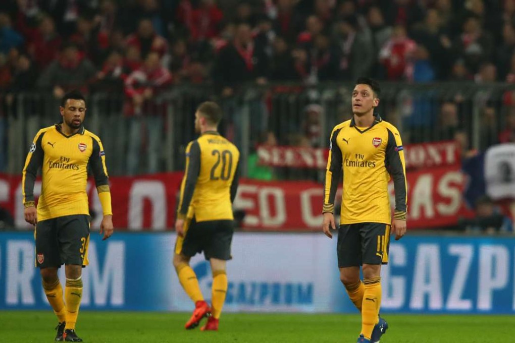 Arsenal's Francis Coquelin, Shkodran Mustafi and Mesut Ozil look dejected after Bayern Munich's Thiago Alcantara scores their third goal Reuters / Michael Dalder Livepic