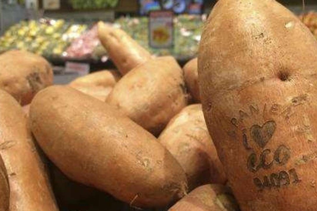 Laser-branded sweet potatoes are displayed at the ICA Kvantum supermarket in Malmo, Sweden. Photo: AP