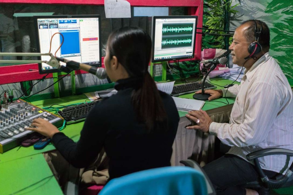 Kong Duong (right), Pol Pot’s former chief propagandist, hosts his Christian radio show. Pictures: Thomas Cristofoletti