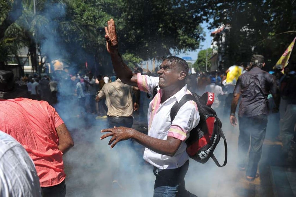 Sri Lankan police use water canons to disperse demonstrators during a protest against the proposed sale of a stake in a loss-making port to a Chinese company in Colombo on February 1, 2017. Protesters led by the leftist People’s Liberation Front, are opposing plans to sell an 80 per cent stake in the US$1.4 billion deep sea port of Hambantota to China Merchants Port Holdings Company. Photo: AFP