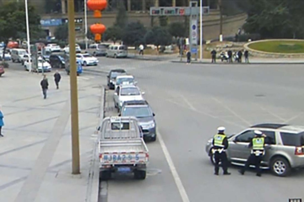 Police had to smash one of the windows on the car to get to the unconscious man. Photo: Handout