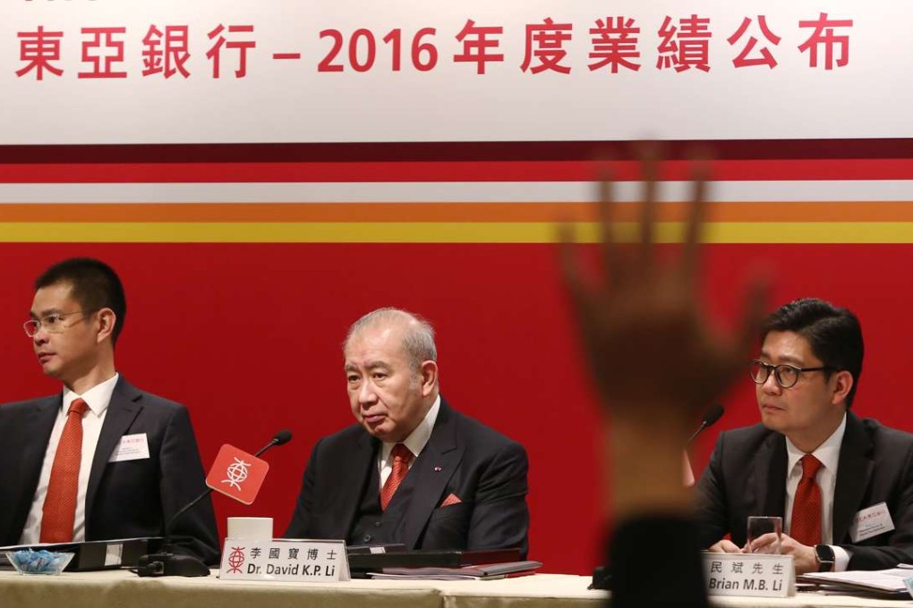 (L to R) Adrian LI Man-kiu, executive director and deputy chief executive, David Li Kwok-po, chairman and chief executive and Brian Li Man-bun, executive director and deputy chief executive answer questions from the floor at the Bank of East Asia’s annual results new conference at the JW Marriott in Admiralty on Friday. Photo: SCMP