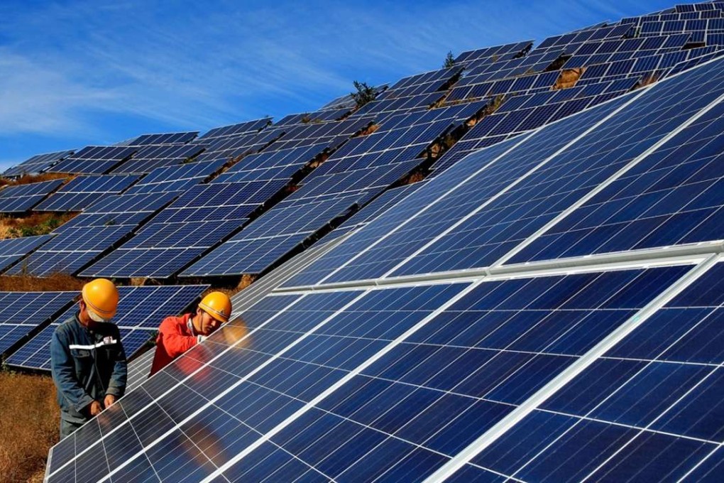 Workers construct a solar power field in Qinhuangdao, north China's Hebei Province. Photo: Xinhua