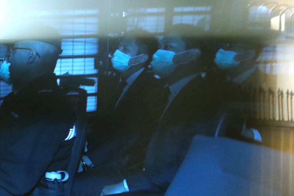 The convicted officers are escorted to court. Photo: Edward Wong