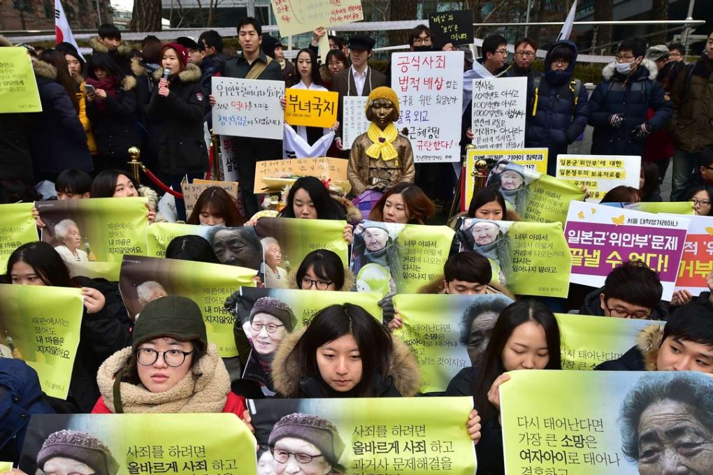 South Korean supporters hold portraits of former "comfort women", who were forced into wartime sexual slavery for Japanese soldiers. Photo: AFP