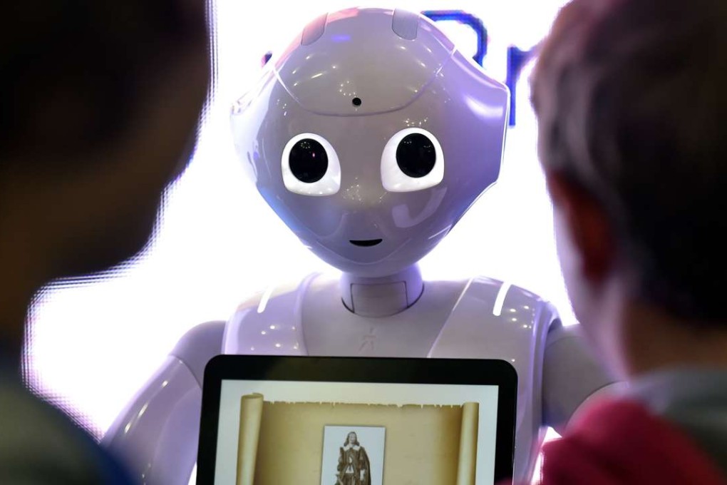 Children interact with Pepper, the programmable humanoid robot. Photo: AFP
