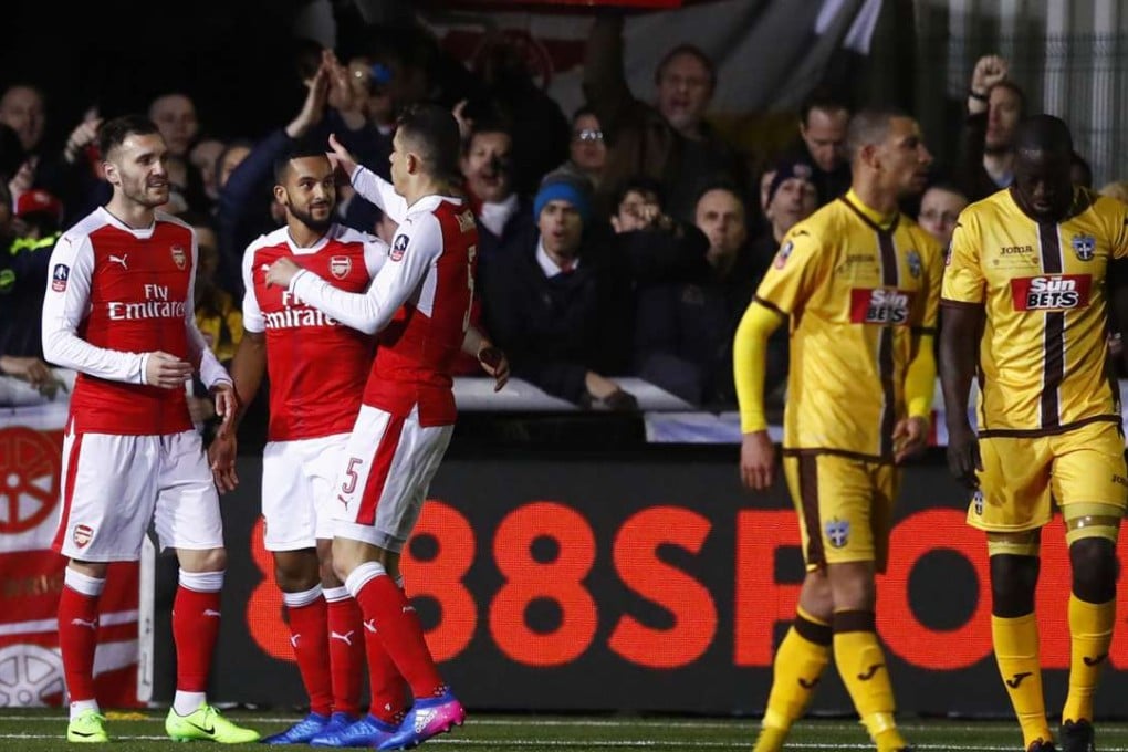 Arsenal’s Theo Walcott celebrates scoring their second goal. Photo: Reuters