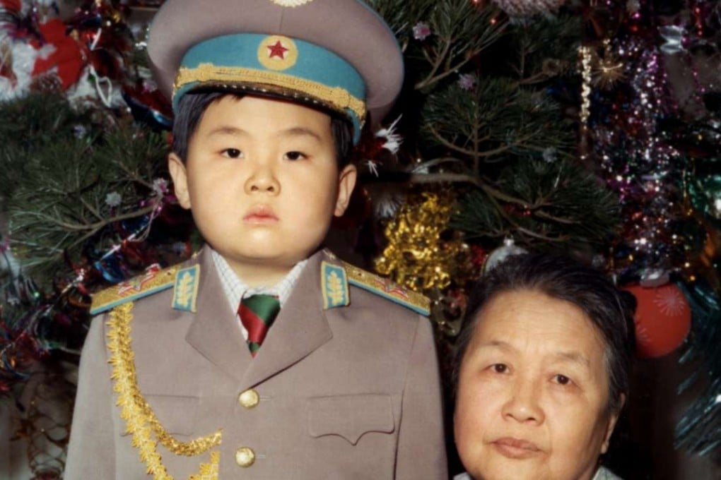 Kim Jong-nam dressed in an army uniform with his maternal grandmother in January 1975. Picture: AFP