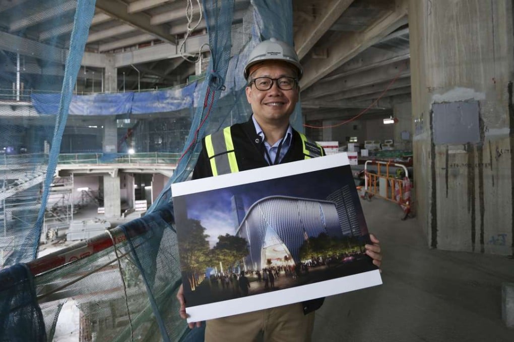 Louis Yu, executive director for performing arts at West Kowloon Cultural District, at the construction site of the Xiqu Centre. He is holding an artist’s impression of the completed building. Picture: Jonathan Wong