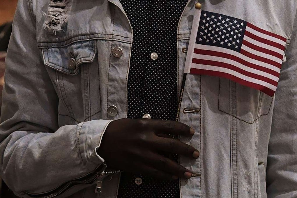 A man pledges allegiance to the United States of America at a naturalisation ceremony for immigrants in Los Angeles last week. Photo: AFP