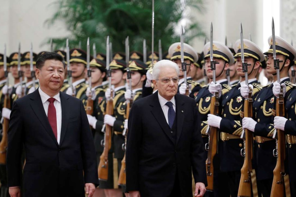 Italian President Sergio Mattarella, right, and Chinese President Xi Jinping inspect an honour guard during a welcoming ceremony for Mattarella at the Great Hall of the People in Beijing, China, on Wednesday. Photo: Reuters