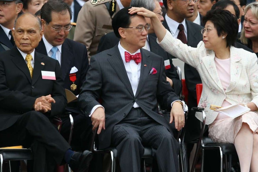 Donald Tsang Yam-kuen (C) with his wife Selina Tsang Pou Siu-mei at the HKSAR Establishment Day flag raising ceremony in Wan Chai. Photo: SCMP