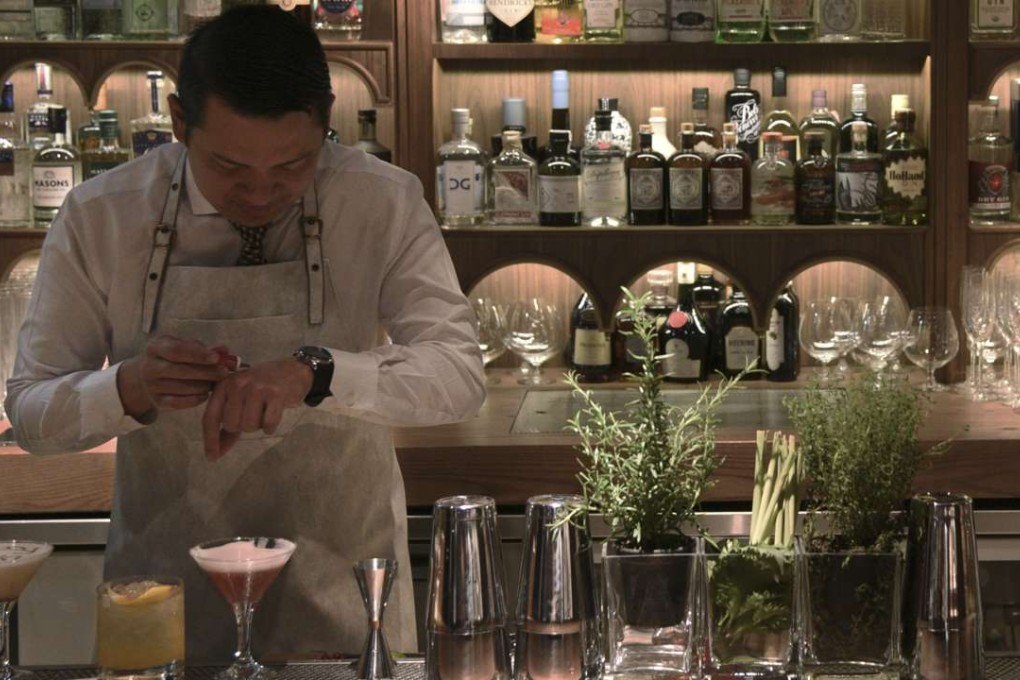 Dr Fern’s Gin Parlour bar manager Gerry Olino prepares a drink.