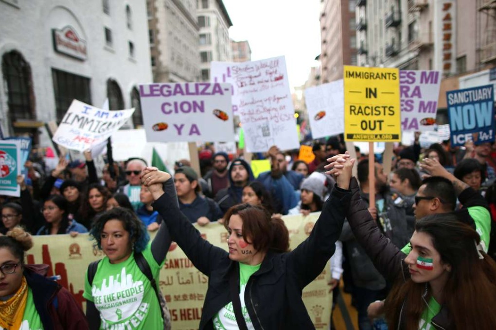 People participate in a protest march calling for human rights and dignity for immigrants, in Los Angeles. Photo: Reuters