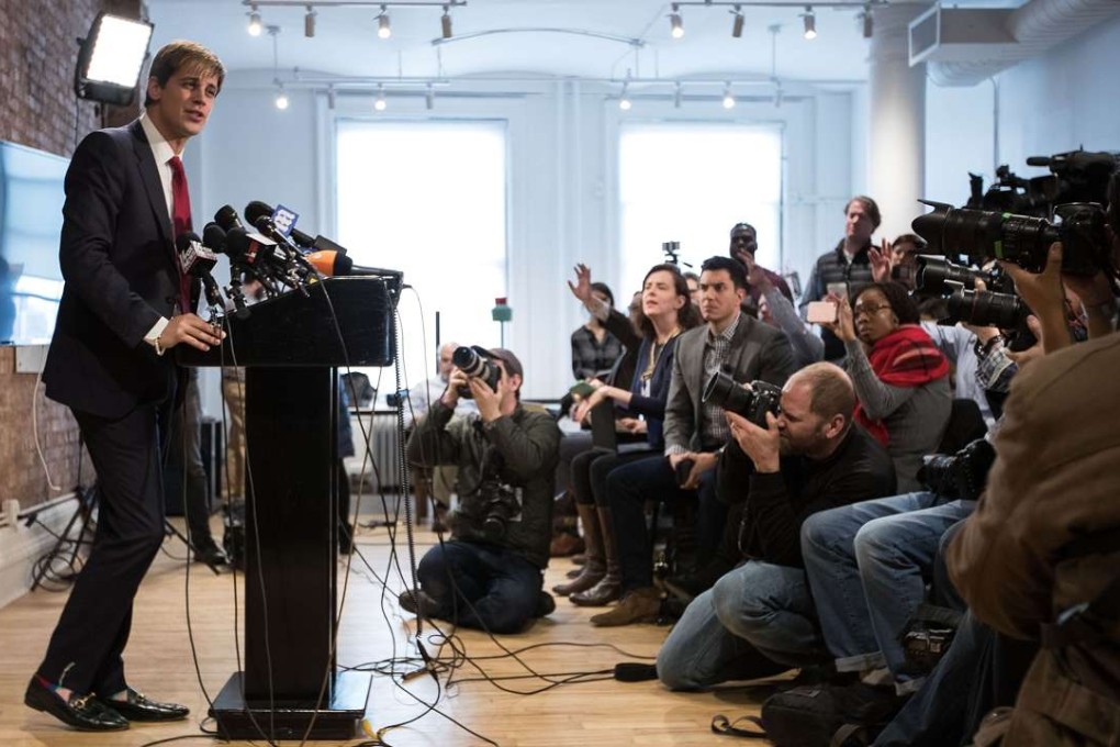Milo Yiannopoulos takes questions from the media during a press conference in New York on Tuesday at which he announced his resignation from Breitbart News. Photo: AFP