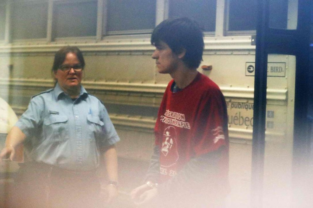 Alexandre Bissonnette, accused of shooting dead six people at a Quebec City mosque, arrives at a city court house on Tuesday. Photo: AFP