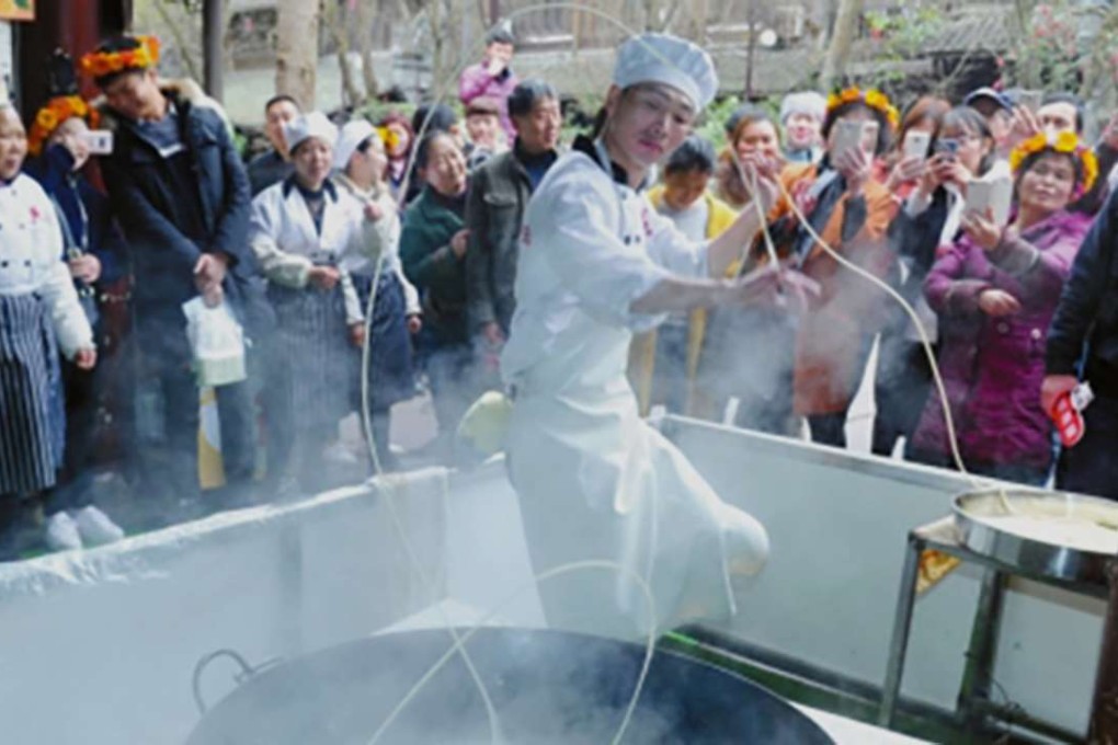 Tian Bo has been reeling in the customers with longevity-noodle serving dance routine. Photo: Handout