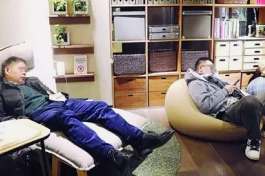 Let’s sleep on it. A shopper takes a nap while another checks his phone at Muji’s flagship store in Shanghai. Photo: Sohu.com