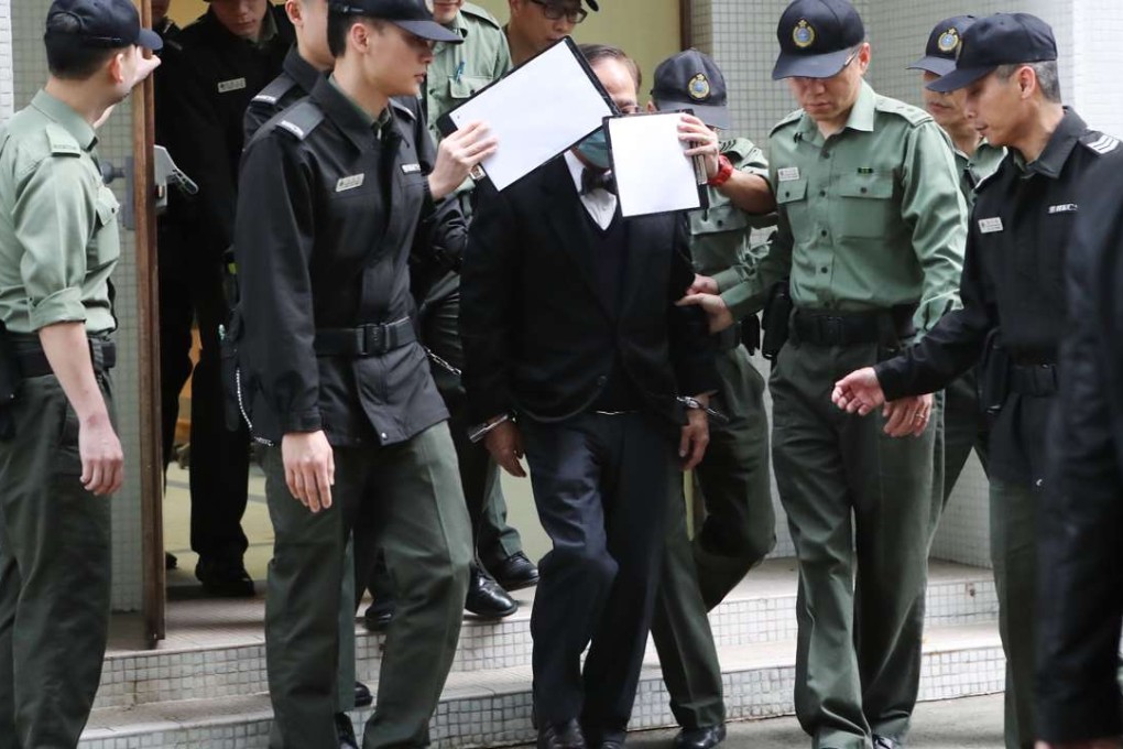 Former chief executive Donald Tsang is escorted to a prison van on February 22. Picture: Edward Wong