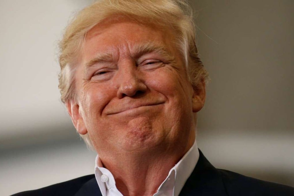 U.S. President Donald Trump smiles as he holds a Make America Great Again rally in Melbourne, Florida, on February 18. Photo: Reuters