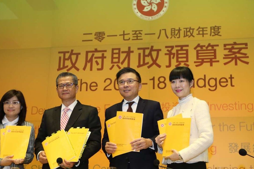 Permanent secretary for financial services and treasury Elizabeth Tse Man-yee (left), Financial Secretary Paul Chan Mo-po, Secretary for the Financial Services and Treasury Chan Ka-keung and government economist Helen Chan present the Hong Kong 2017-18 budget. Photo: Xiaomei Chen