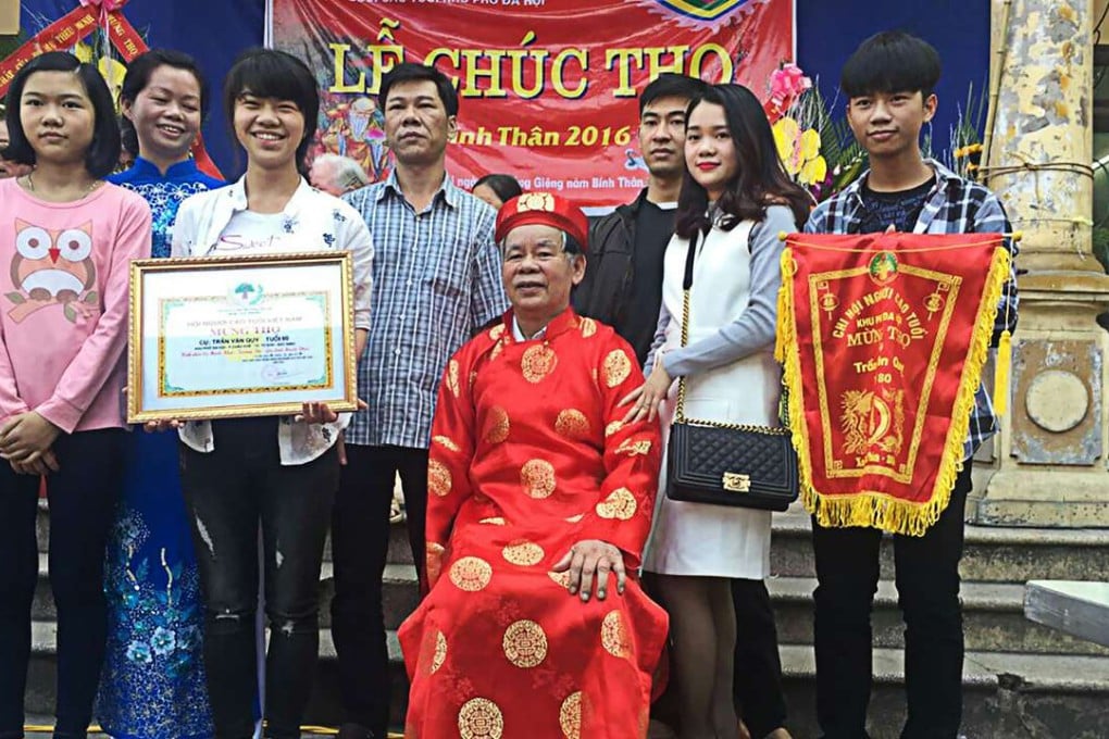 Three generations of Tran Van Quy’s family celebrate his traditional Vietnamese longevity ceremony. Handout photo